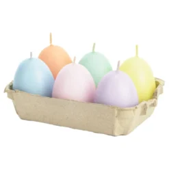 Pastellinsävyiset munanmuotoiset steariinikynttilät